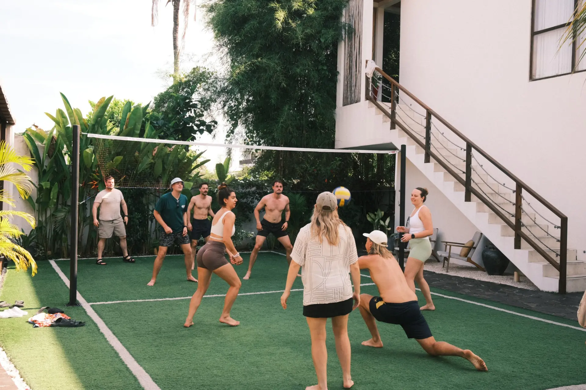Group playing volleyball at the villa